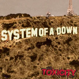 Album cover of Toxicity by System of a Down: the band name in large white letters on a dry hillside